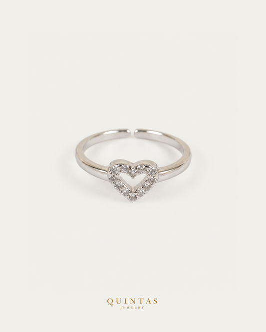 Amelia Heart Silver Ring (Adjustable) — authentic gold QUINTAS JEWELRY logo, standalone lying main, smaller centered framing