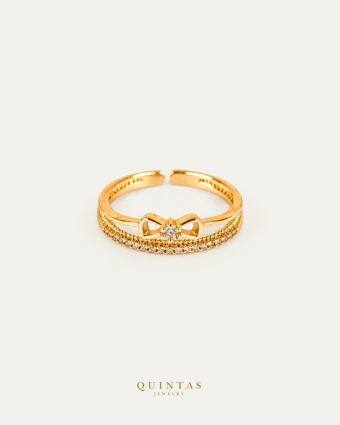 Ara Diamond Ribbon Ring (Adjustable) — authentic gold QUINTAS JEWELRY logo, standalone lying main, smaller centered framing
