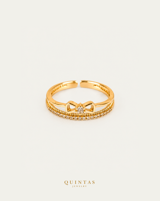 Ara Diamond Ribbon Ring (Adjustable) — authentic gold QUINTAS JEWELRY logo, standalone lying main, smaller centered framing