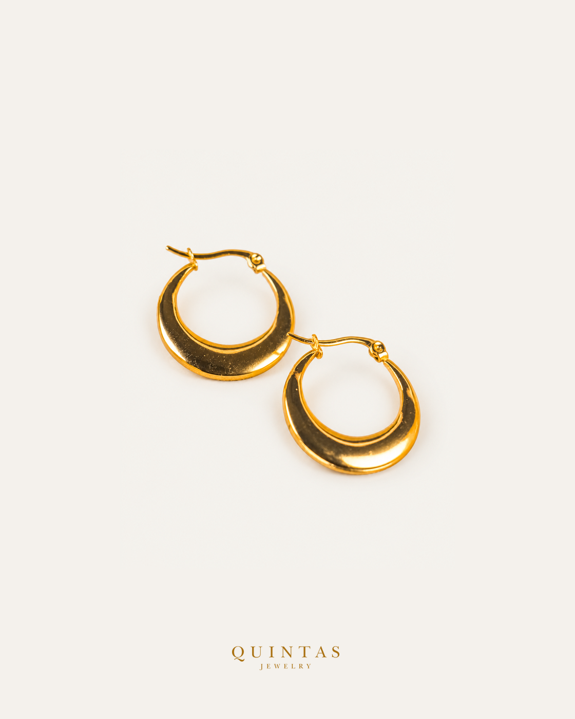 Nicola Hoop Earrings — source-backed complete hoop pair, source-backed main view, small balanced off-white composition and authentic canonical logo