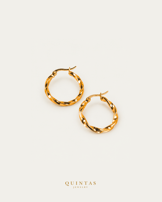 Seraphine Twisted Hoop Earrings — genuine open-lever hoop pair, source-backed main view, small balanced off-white composition and authentic canonical logo