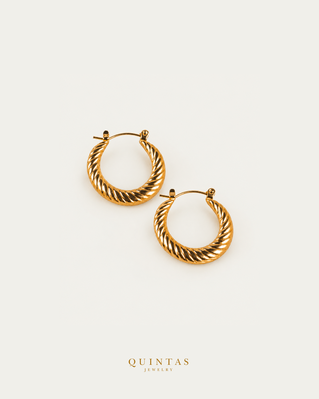 Solenne Twisted Hoop Earrings — genuine open-lever hoop pair, source-backed main view, small balanced off-white composition and authentic canonical logo