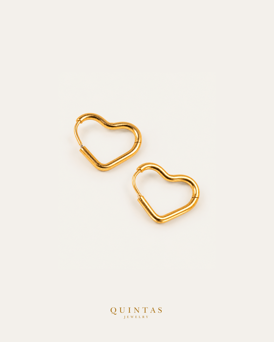 Amor Heart Hoop Earrings — source-backed complete hoop pair, source-backed main view, small balanced off-white composition and authentic canonical logo