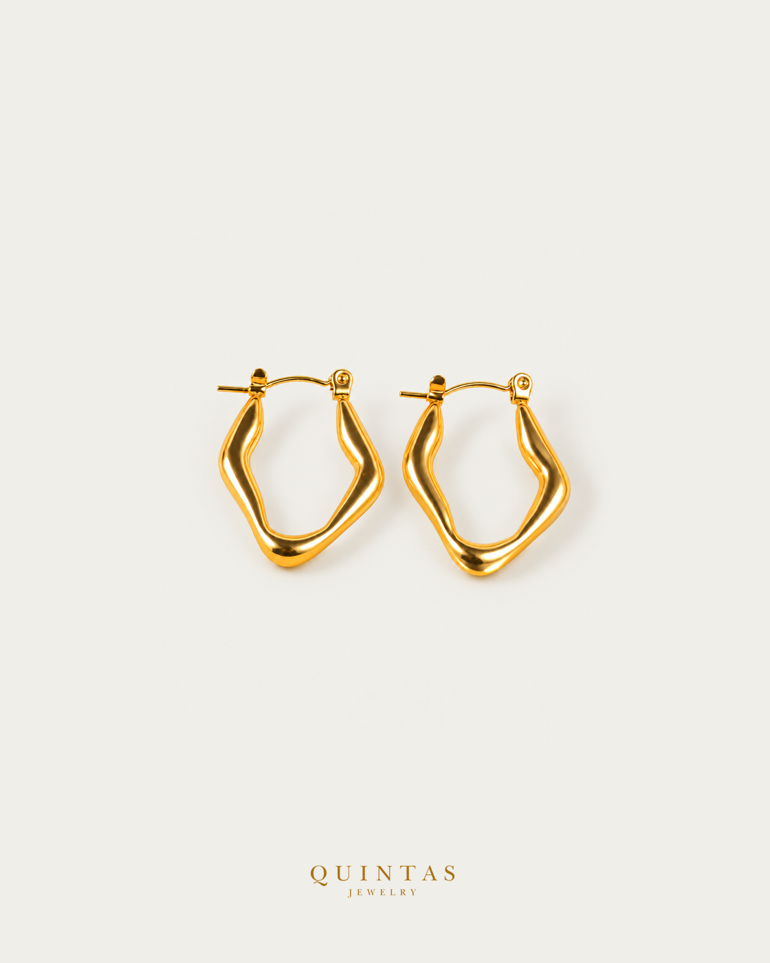 Vela Wave Hoop Earrings — source-verified main view with balanced off-white framing and authentic canonical logo