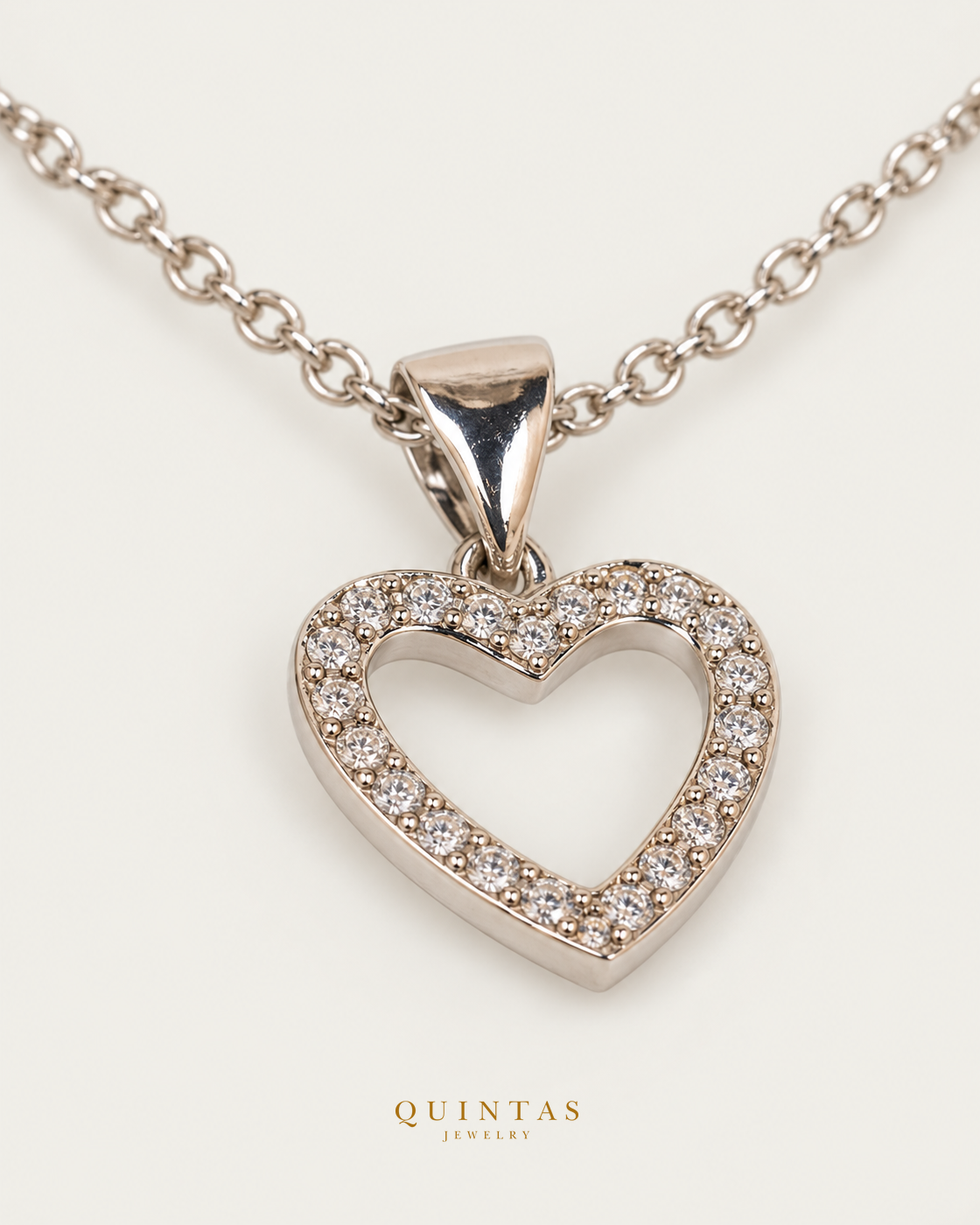Arielle Silver Heart Necklace — exact source-supported second framing and jewelry unchanged, authentic canonical logo