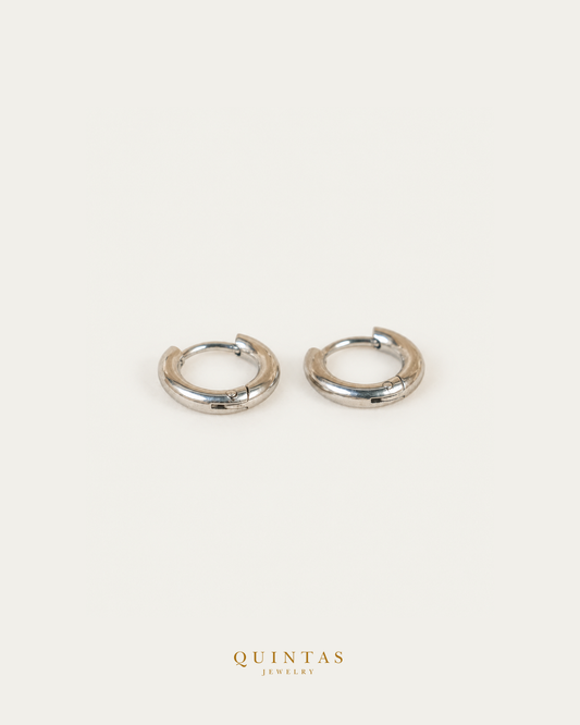 Classic Hoop Silver Earrings — source-backed complete hoop pair, source-backed main view, small balanced off-white composition and authentic canonical logo