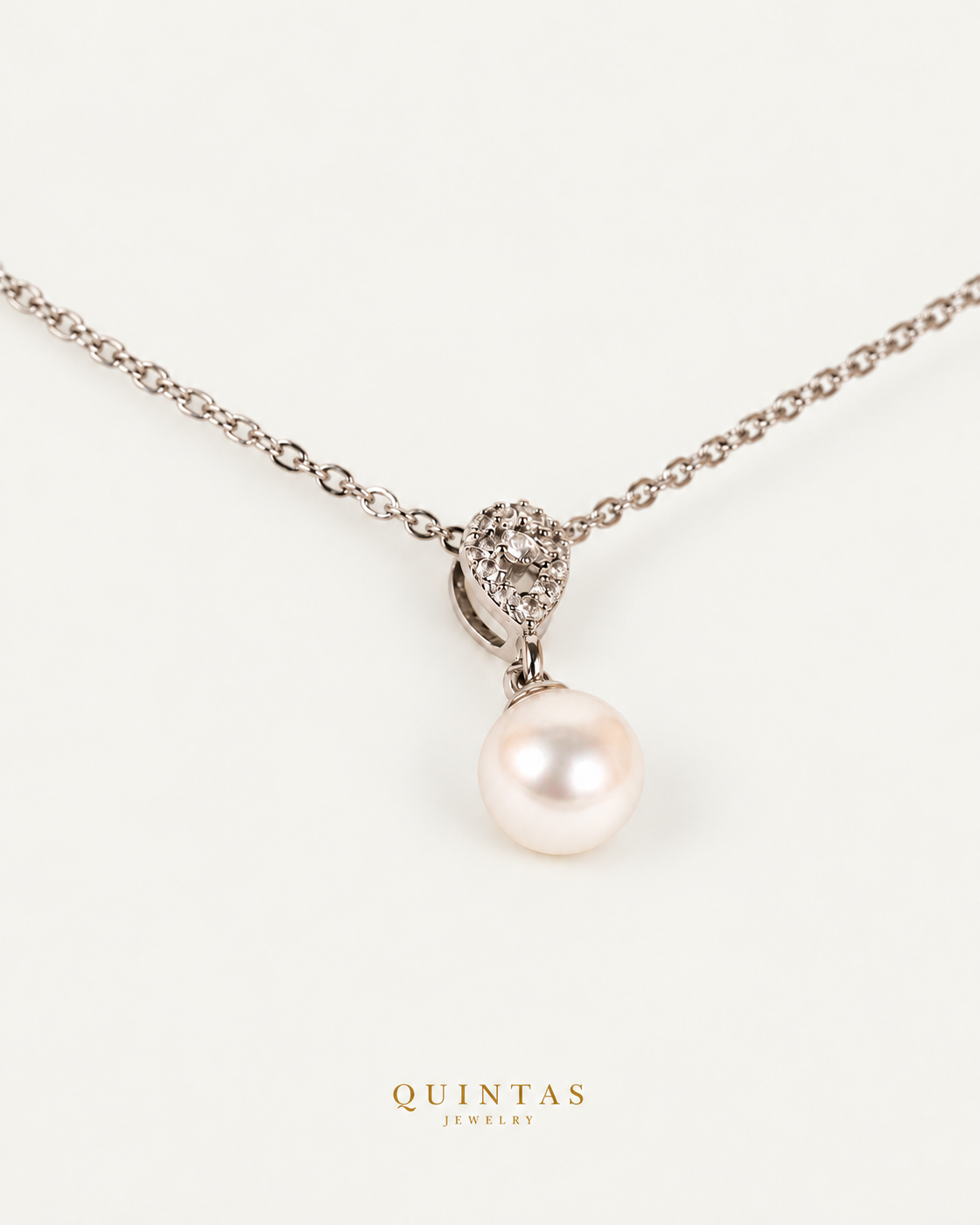 Althea Pearl Silver Necklace — exact source-supported second framing and jewelry unchanged, authentic canonical logo