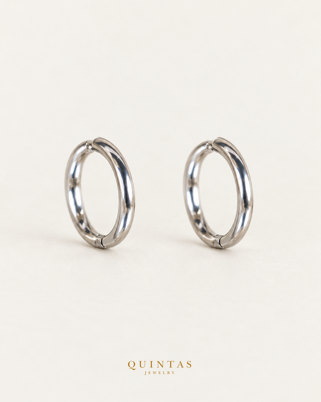 Classic Hoop Silver Earrings — matching pair, standing complementary angle, Quintas Jewelry