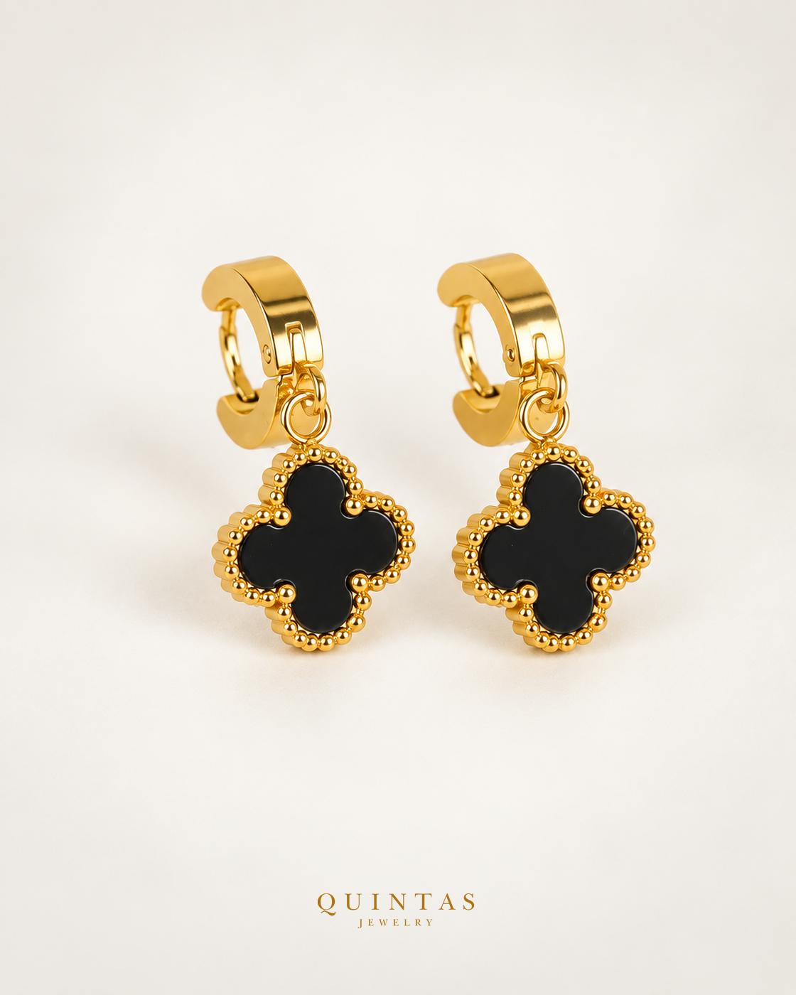 Clover Black earrings — matching pair on off-white, Quintas Jewelry