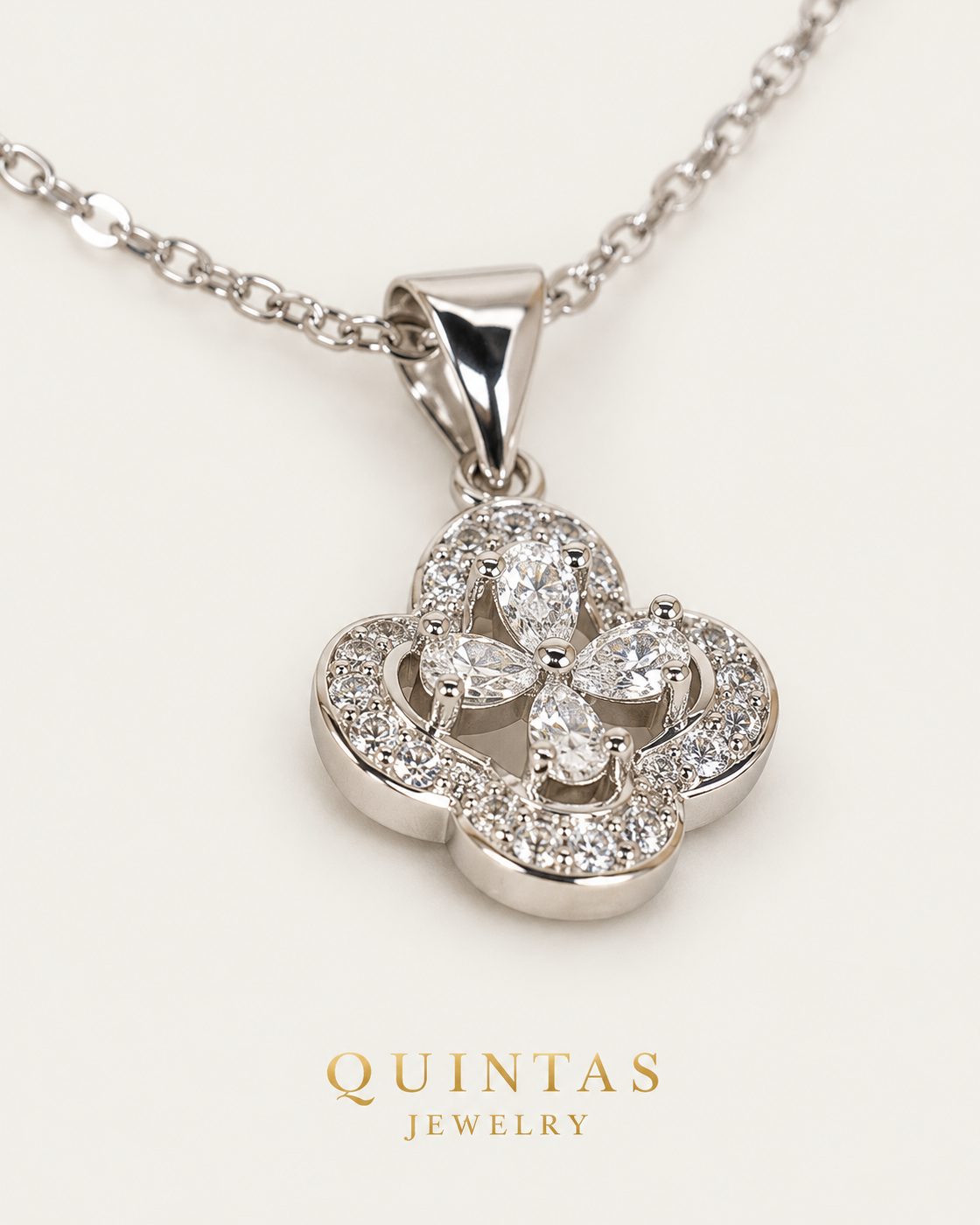 Frosted Clover Silver — cable chain, genuine oblique detail, neutral greige background