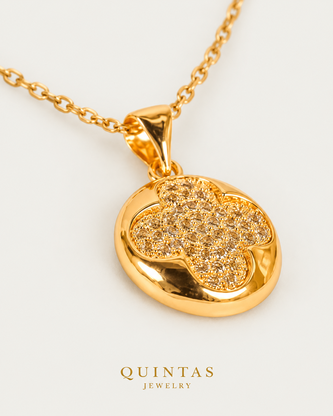 Golden Clover Necklace — cable chain, genuine oblique detail, neutral greige background