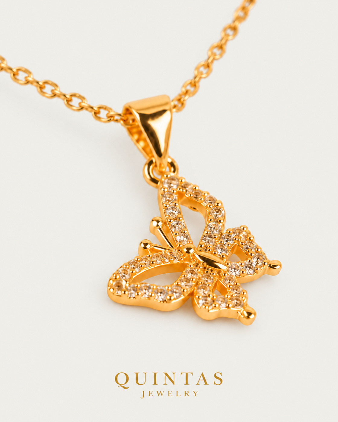 Iris Butterfly — cable chain, genuine oblique detail, neutral greige background