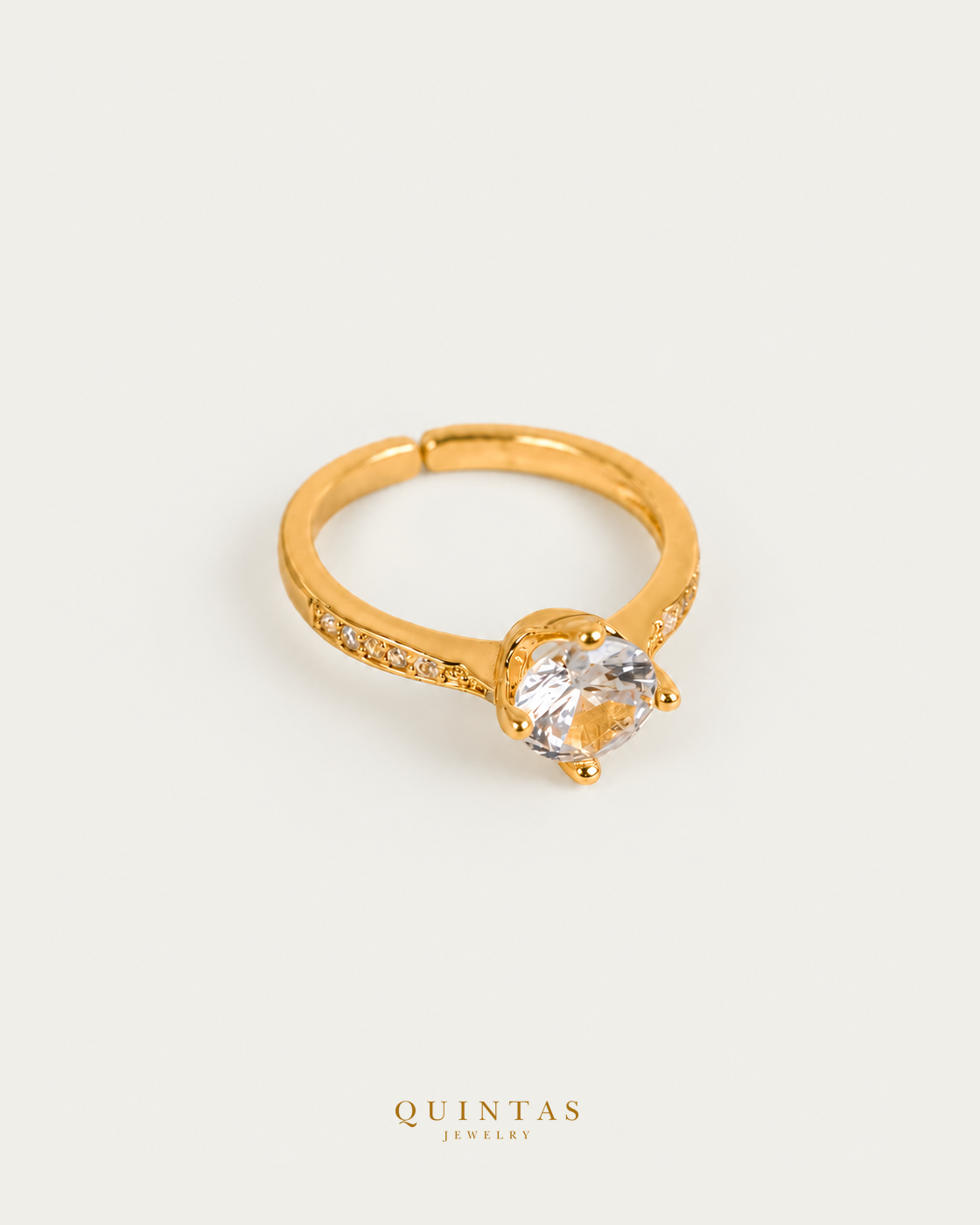Katherine Diamond Circle Ring — smaller standalone lying view with canonical gold QUINTAS JEWELRY logo
