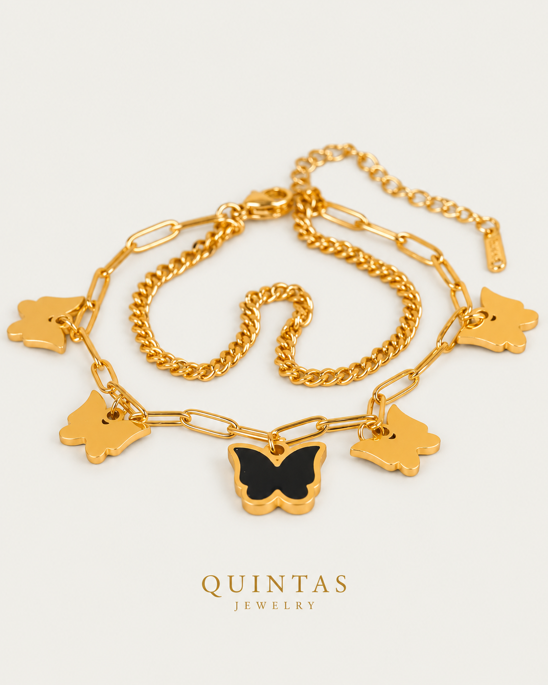 Midnight Butterfly Bracelet — gold bracelet, front hero, neutral greige background
