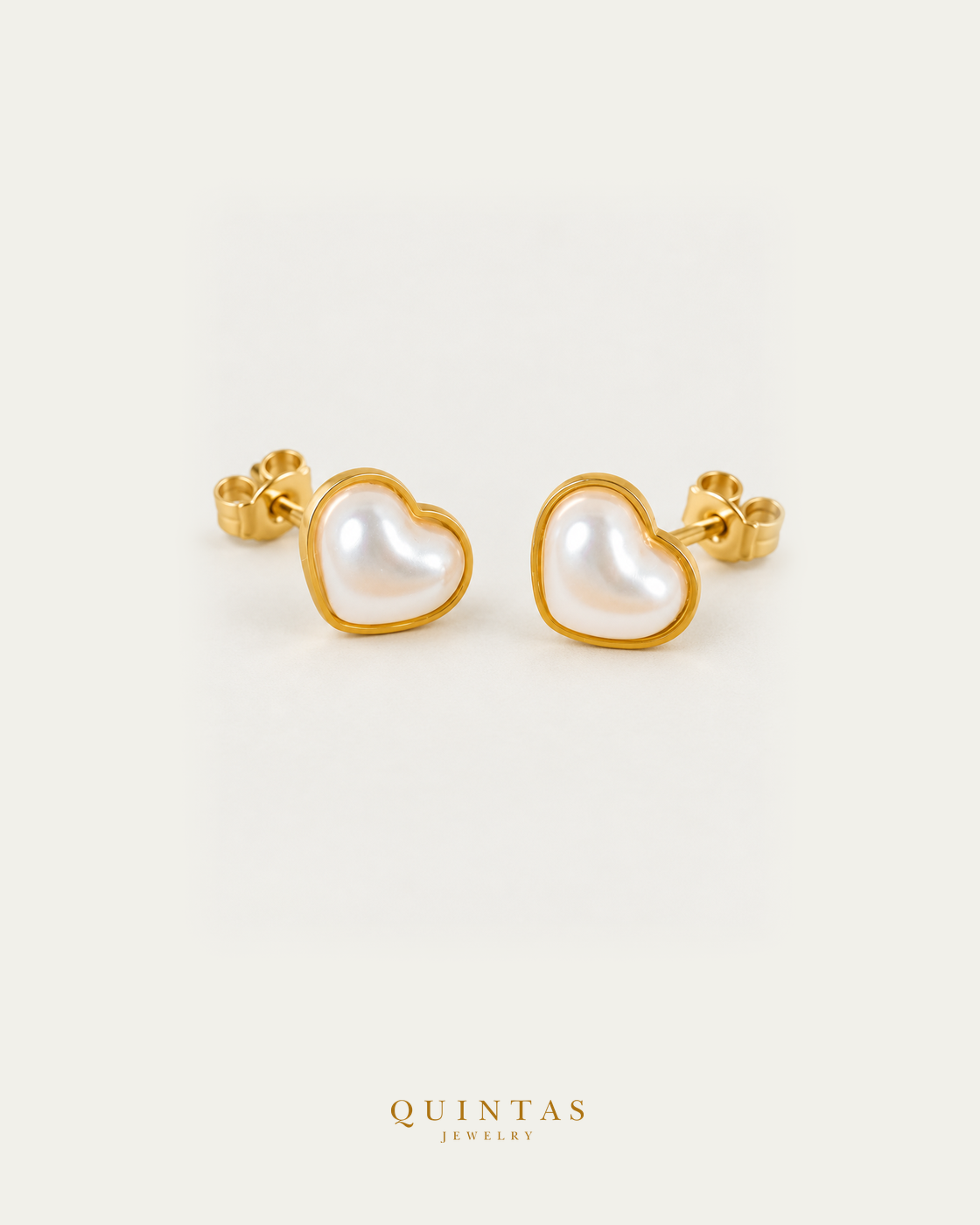 Pearl Heart stud earrings pair, main angle with visible pushback stems on off-white