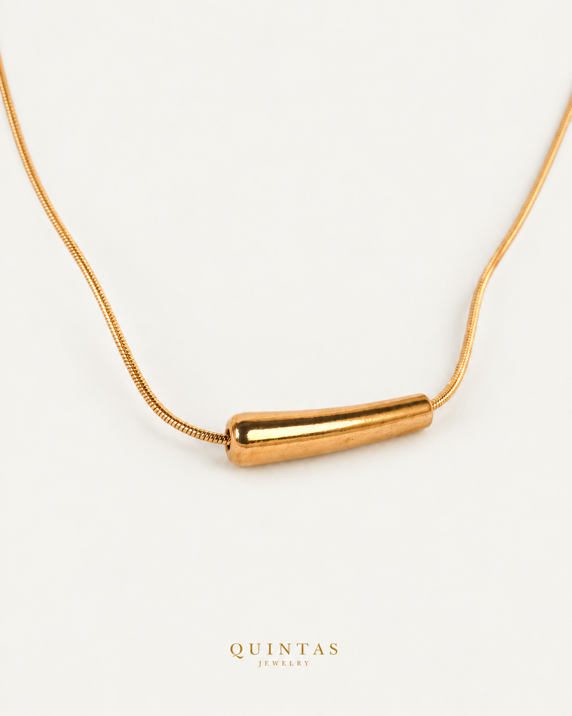 Aure Bar Necklace — gold snake chain, companion view, canonical Quintas logo