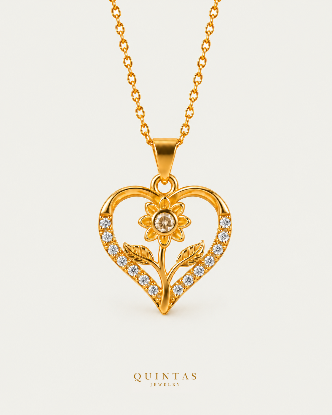 Flower Heart Charm Necklace on gold cable chain, hero angle, neutral greige