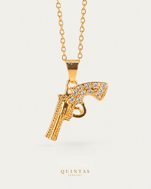 Pistol Charm Necklace — source-verified cable front view, off-white background, canonical gold logo