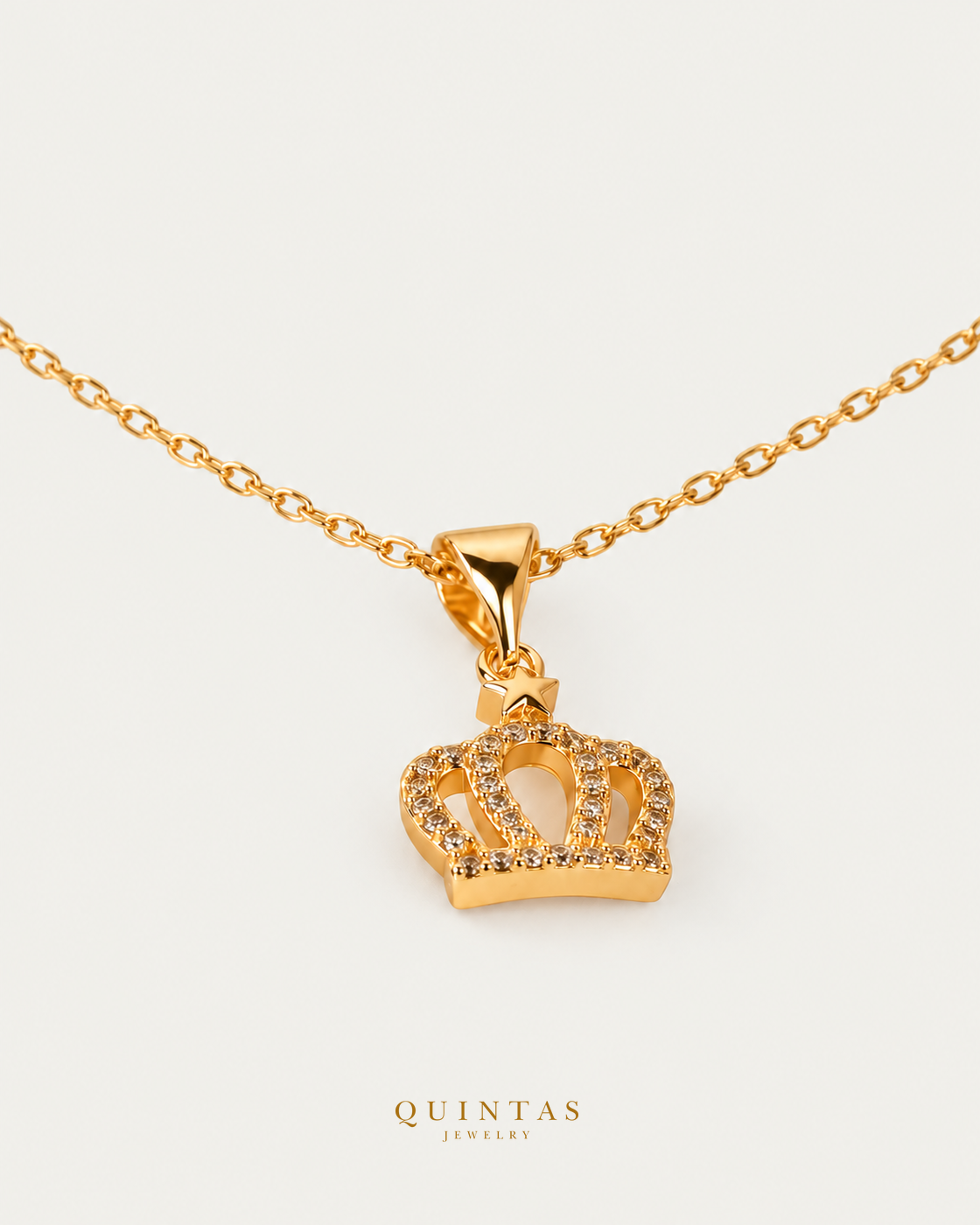 Royal Crown Necklace — source-verified cable oblique view, off-white background, canonical gold logo