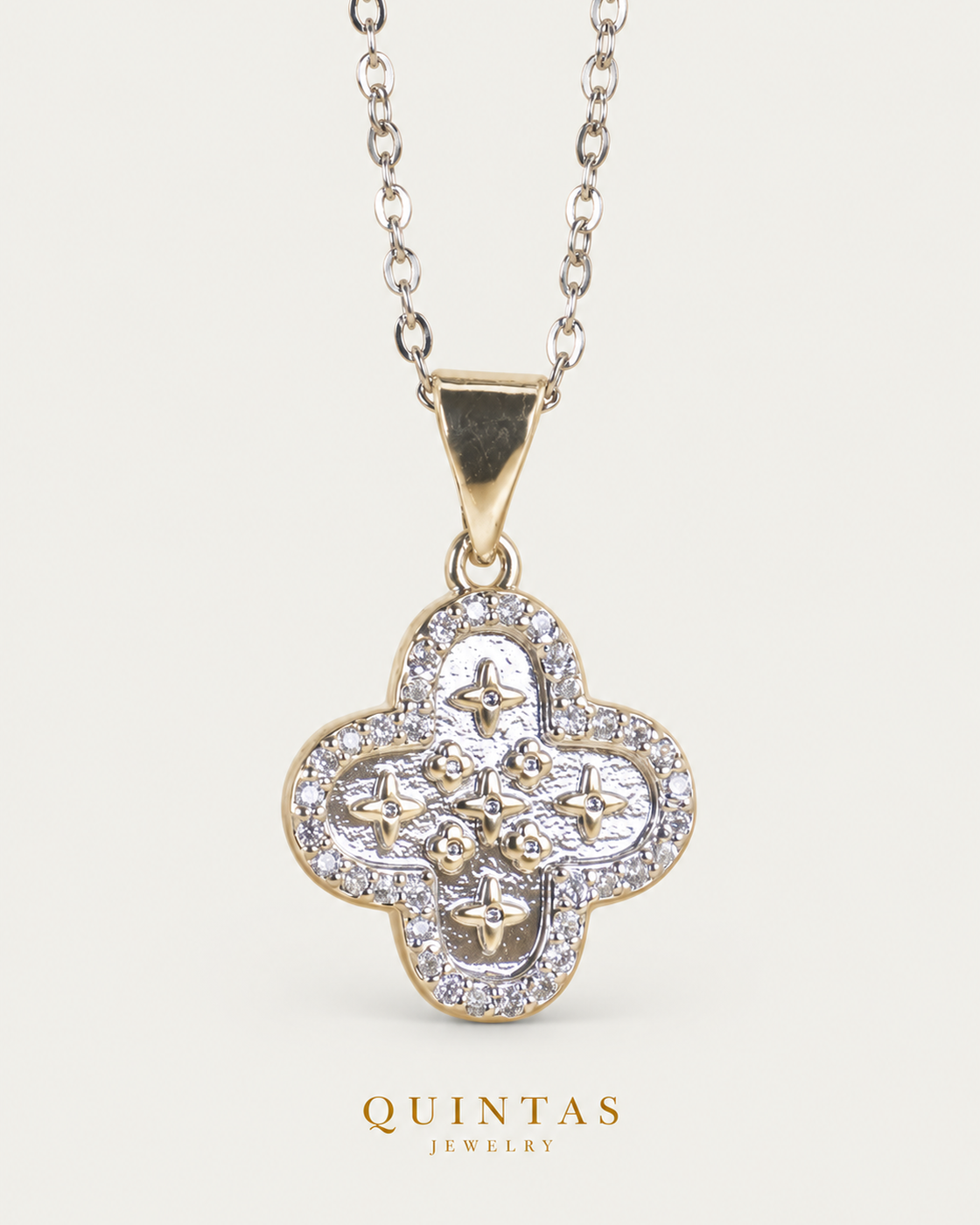 Silver Clover Charm Necklace cable chain hero angle on neutral greige