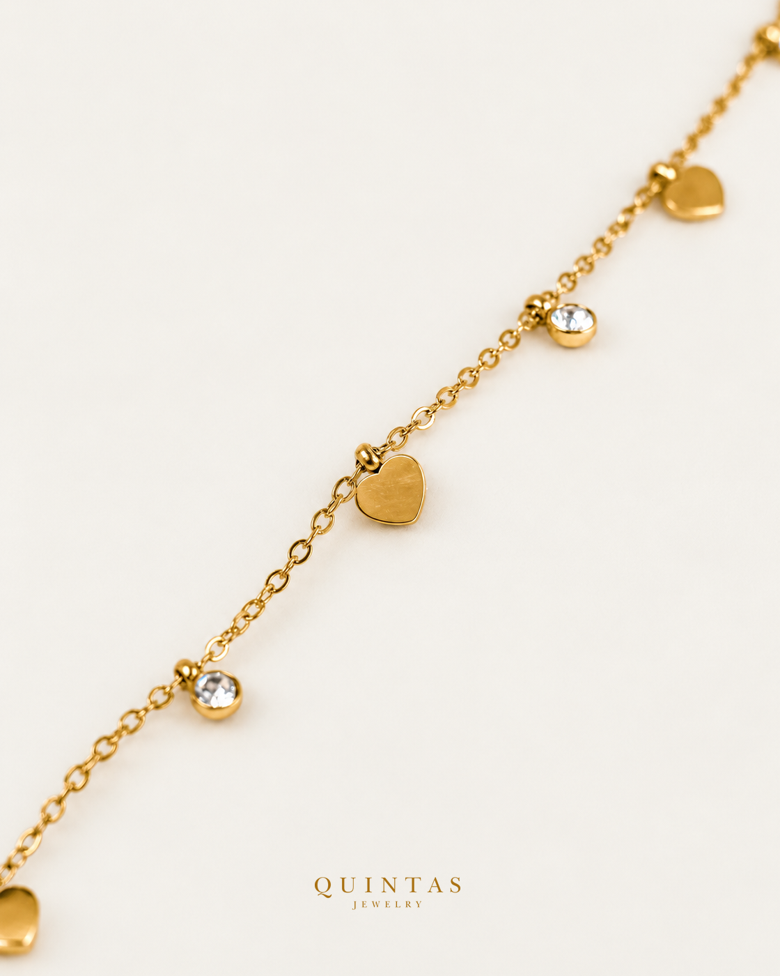 Agatha Hearts and Diamonds Bracelet — source-verified naturally cropped bracelet detail, off-white background, canonical gold logo