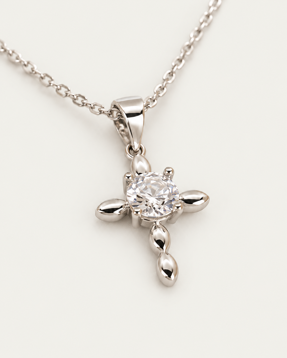 Dainty Cross Diamond Silver cable chain companion photographed angle on neutral greige