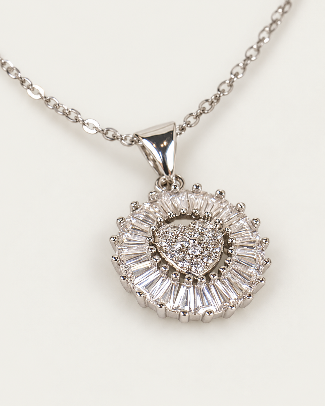 Dazzling Glass Heart Silver cable chain companion photographed angle on neutral greige