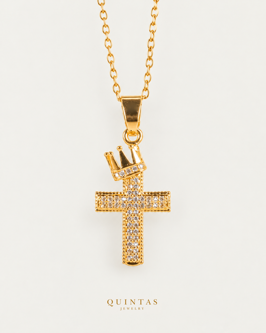 King of Kings Cross Necklace — gold cable, frontal hero, neutral greige; canonical Quintas Jewelry logo