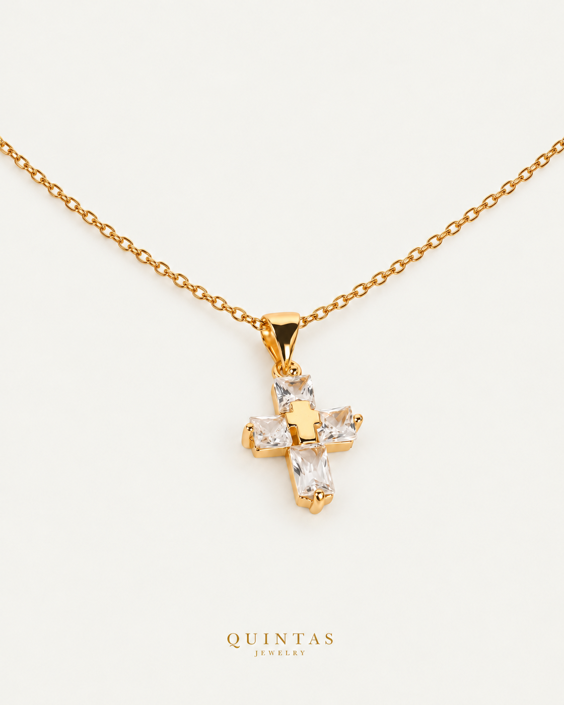 Luméa Crystal Cross Necklace gold cable chain companion view, canonical Quintas logo