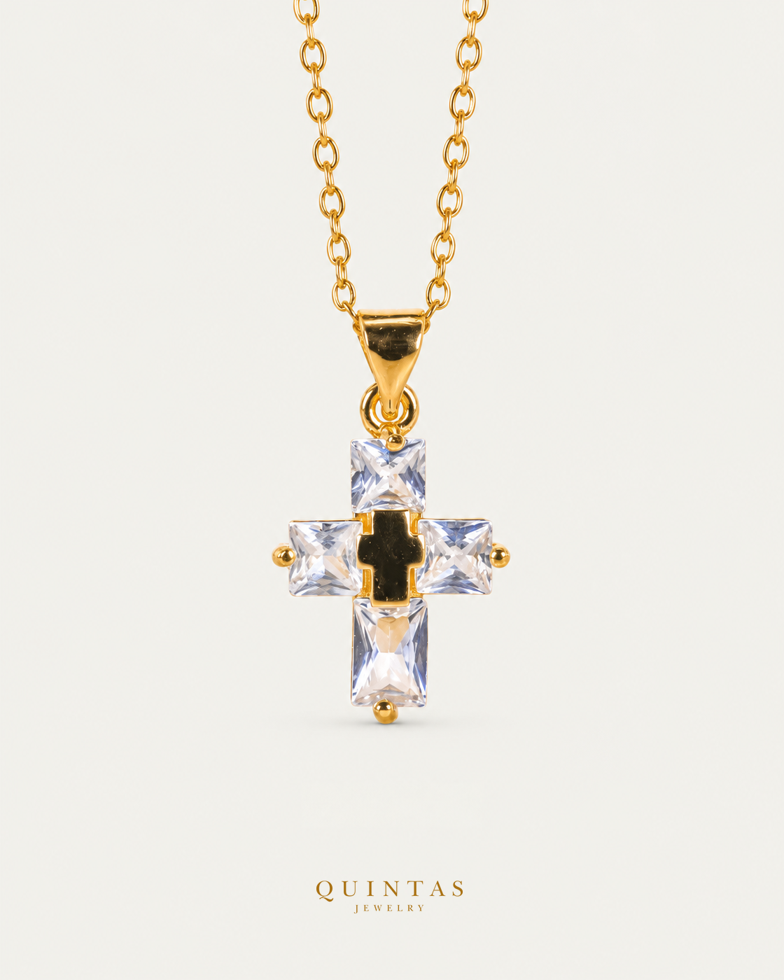 Luméa Crystal Cross Necklace gold cable chain main view, canonical Quintas logo