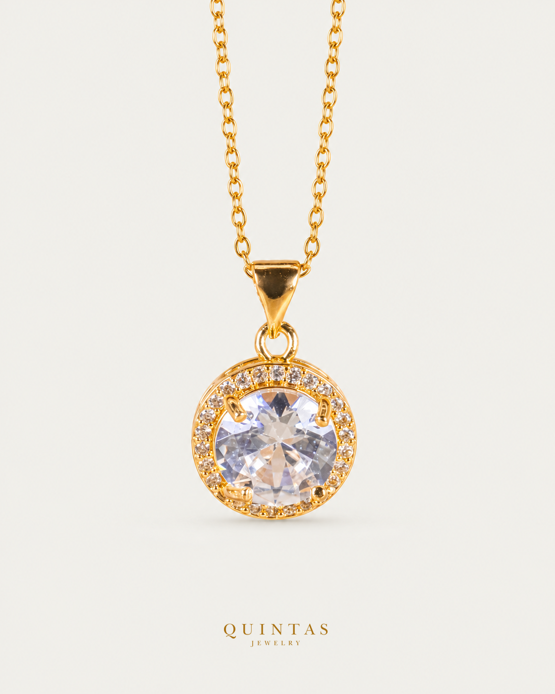 SolenneHalo necklace — actual cable-chain front view, neutral greige; canonical Quintas Jewelry logo