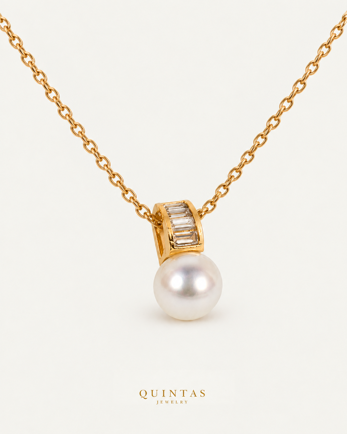 Lustra Pearl Drop Necklace — source-verified cable oblique view, off-white background, canonical gold logo
