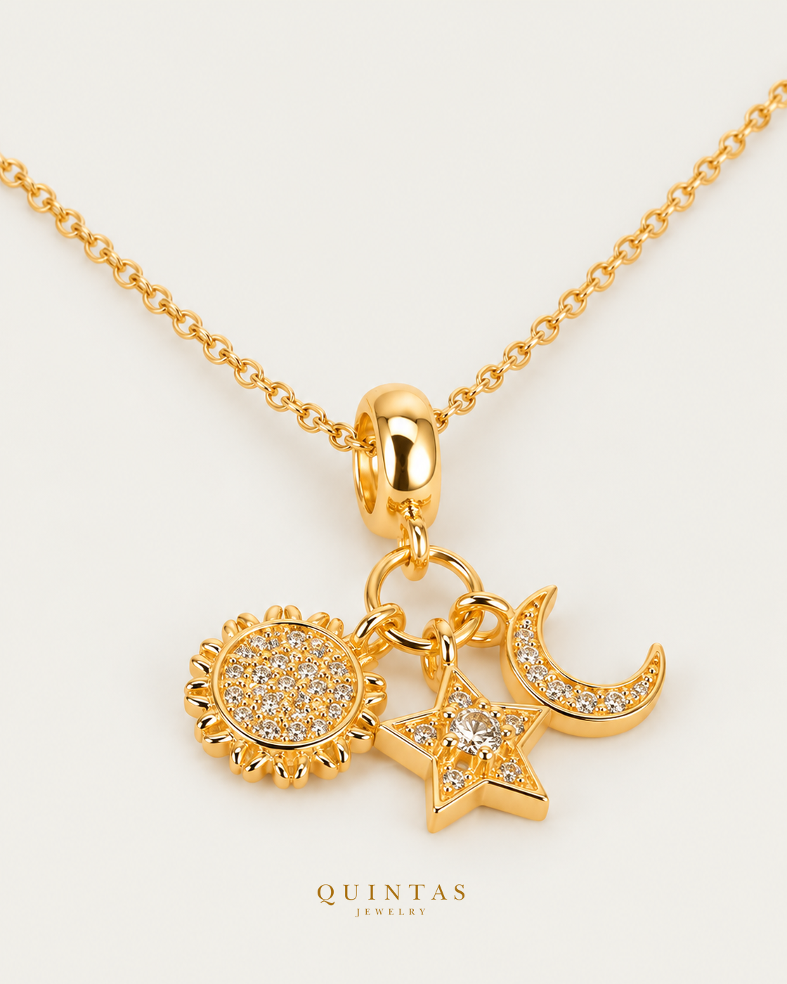 Sun, Moon, and Star Necklace, gold cable chain, oblique view