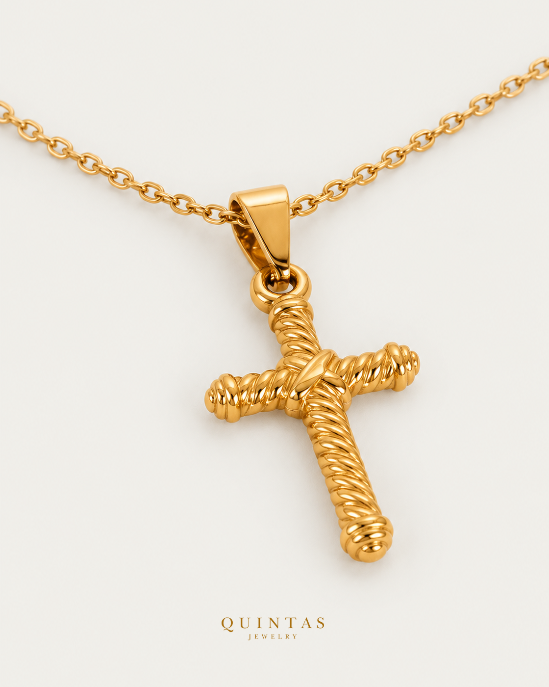Callisto Rope Cross Necklace, gold cable chain, oblique view; canonical Quintas Jewelry logo