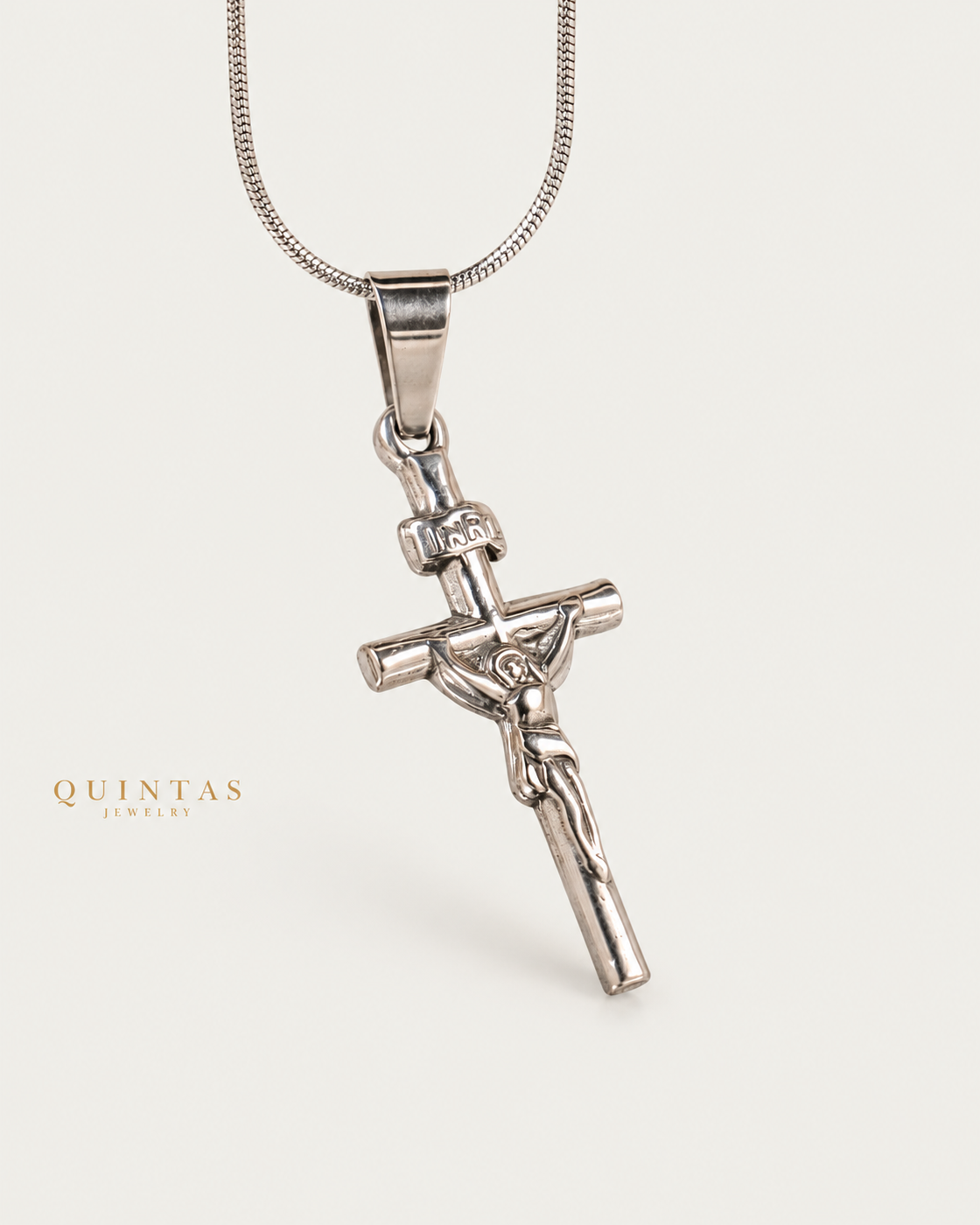 Jesus Crucifix Silver Necklace Silver Snake Chain companion angle on neutral greige