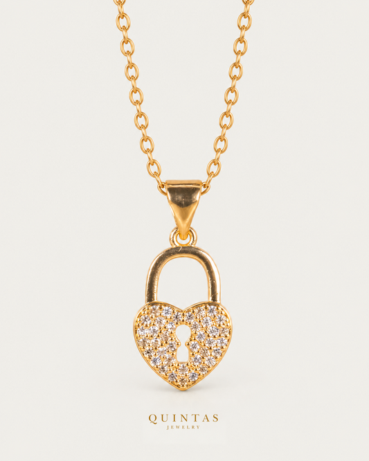 Amara Heart Lock Necklace — source-verified cable front view, off-white background, canonical gold logo
