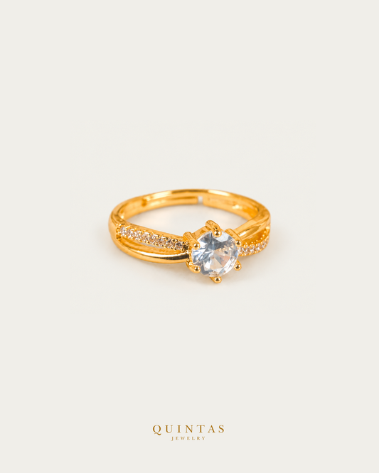 Celeste Solitaire Gold Ring (Adjustable), smaller standalone full ring view, neutral greige, authentic Quintas Jewelry gold logo