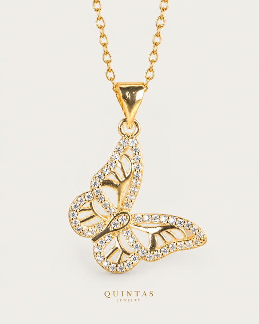Marielle Butterfly Necklace Gold Cable Chain hero angle on neutral greige