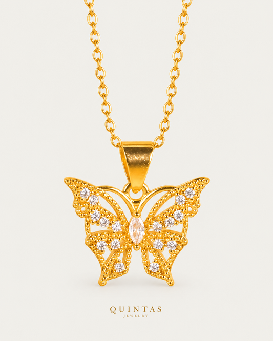 Mira Butterfly Necklace Gold Cable Chain hero angle on neutral greige