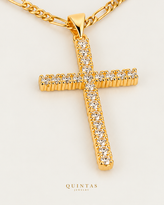 Solace Cross Necklace Figaro Golden Chain hero angle on neutral greige; canonical Quintas Jewelry logo