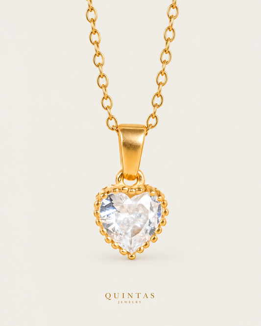 Crystal Heart Necklace — source-verified cable front view, off-white background, canonical gold logo