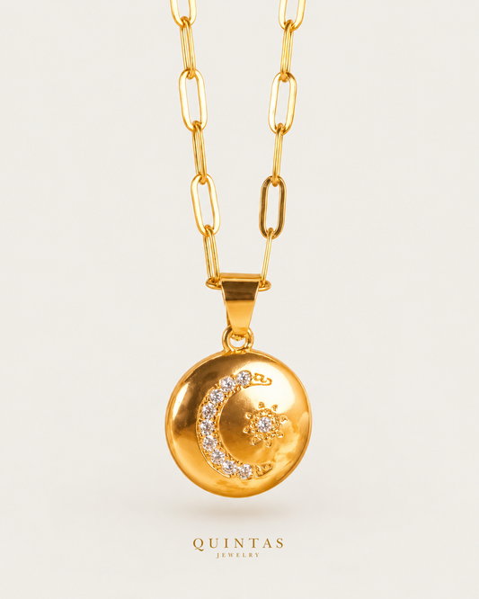 Guiding Star Medallion Necklace — source-verified paperclip main view, off-white background, canonical gold logo