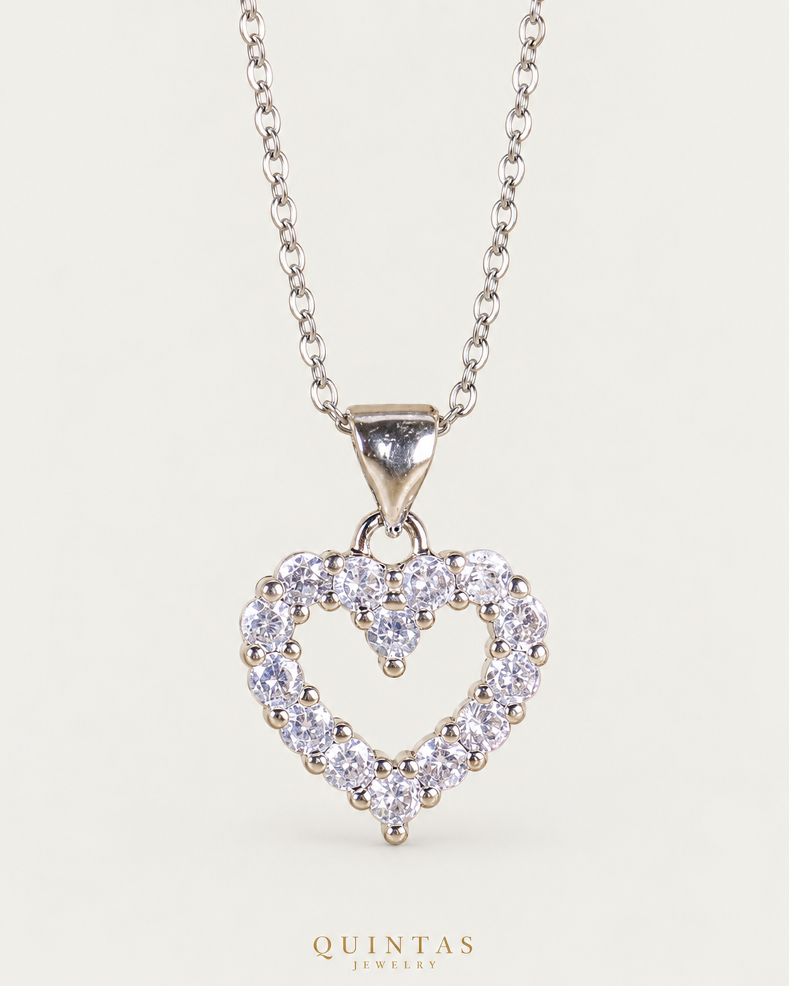 Iced Heart Silver Necklace Silver Cable Chain hero angle on neutral greige