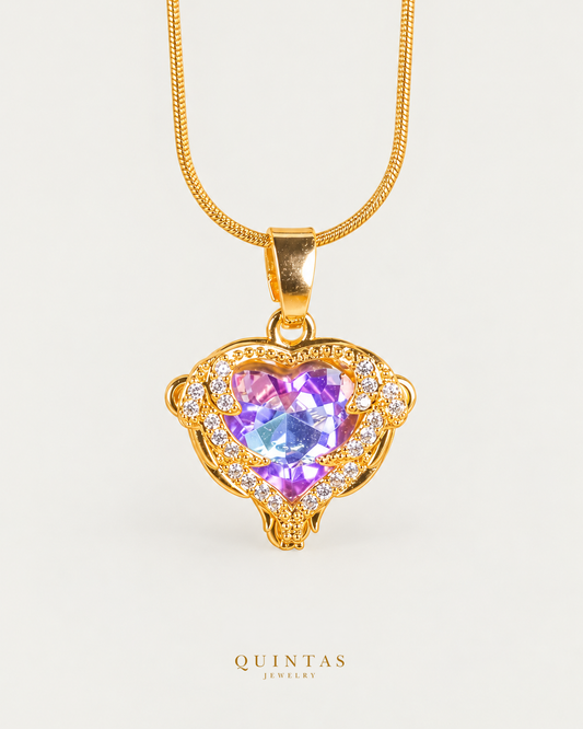 Twilight Heart Necklace gold snake chain, front hero on neutral greige; canonical Quintas Jewelry logo