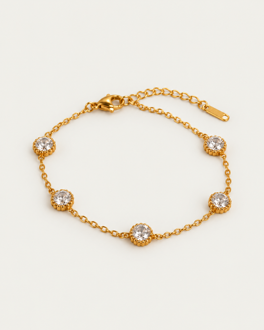 Aure Spark actual gold bracelet hero photographed angle on neutral greige