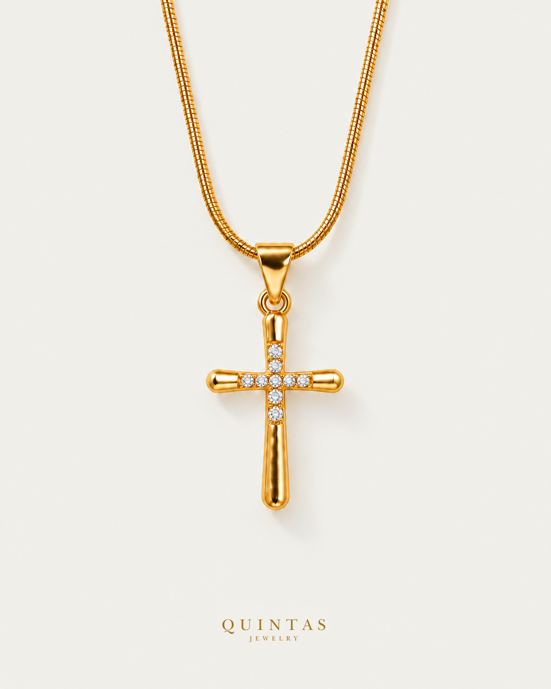 Studded Cross Necklace on premium snake chain, hero angle, neutral greige