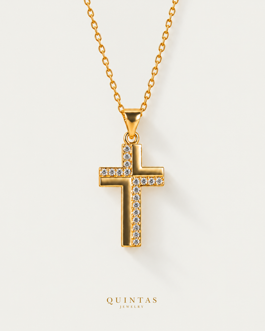 Gabrielle Cross Necklace — cable chain, neutral greige hero; canonical Quintas Jewelry logo