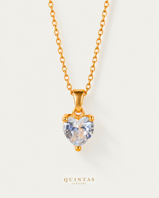 Diamond Heart Necklace — source-verified cable front view, off-white background, canonical gold logo