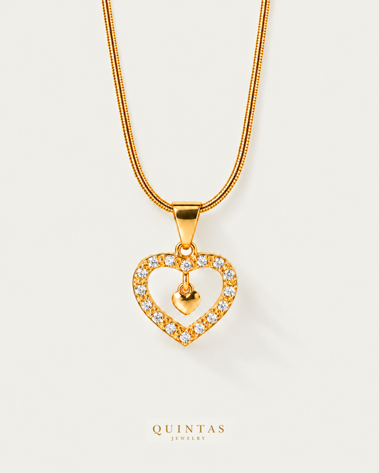 Audrey Sparkling Heart Necklace — source-verified snake front view, off-white background, canonical gold logo