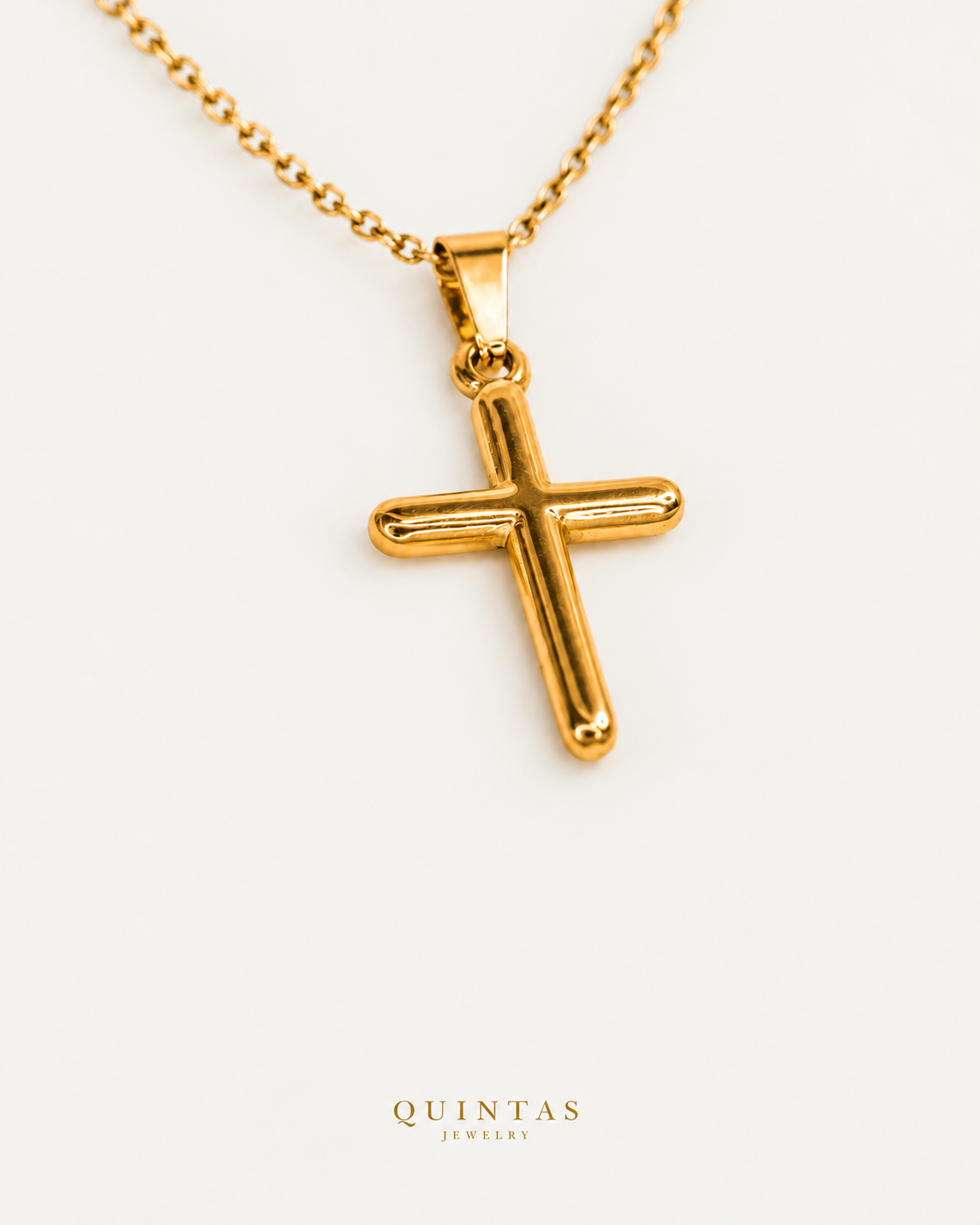 Minimalist Cross Necklace — gold cable chain, companion view, canonical Quintas logo